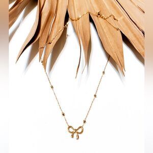 Gold bow necklace  #1027